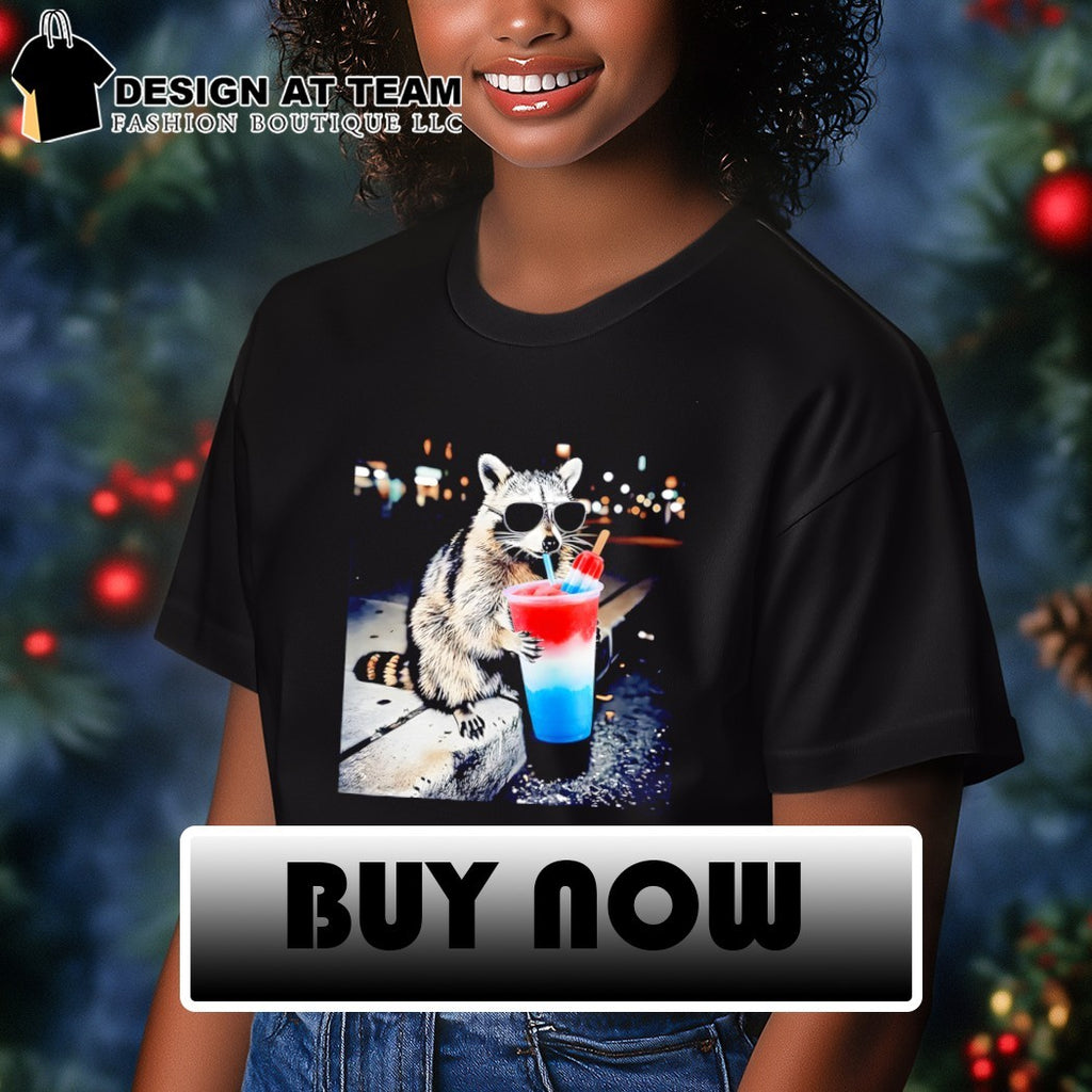 Raccoon holding a red white and blue slushy with popsicle shirt