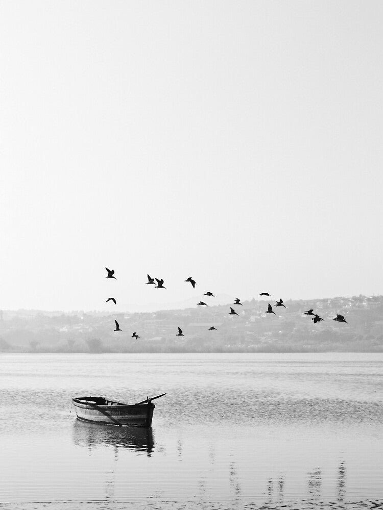 Boat sailing across a lake by MyInspiredPrint