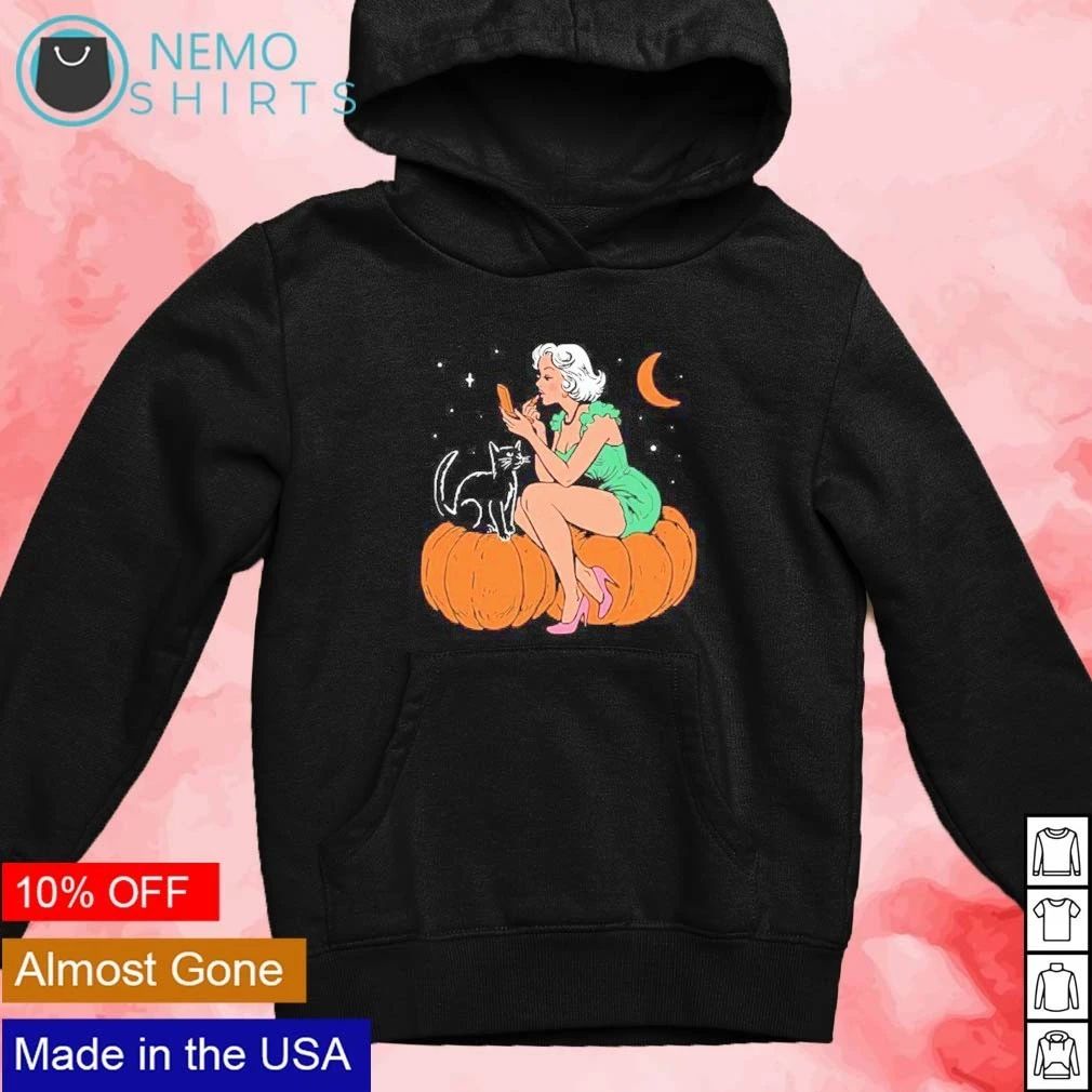 Pinup Girl Applying Lipstick on a Pumpkin with a Black Cat Halloween shirt