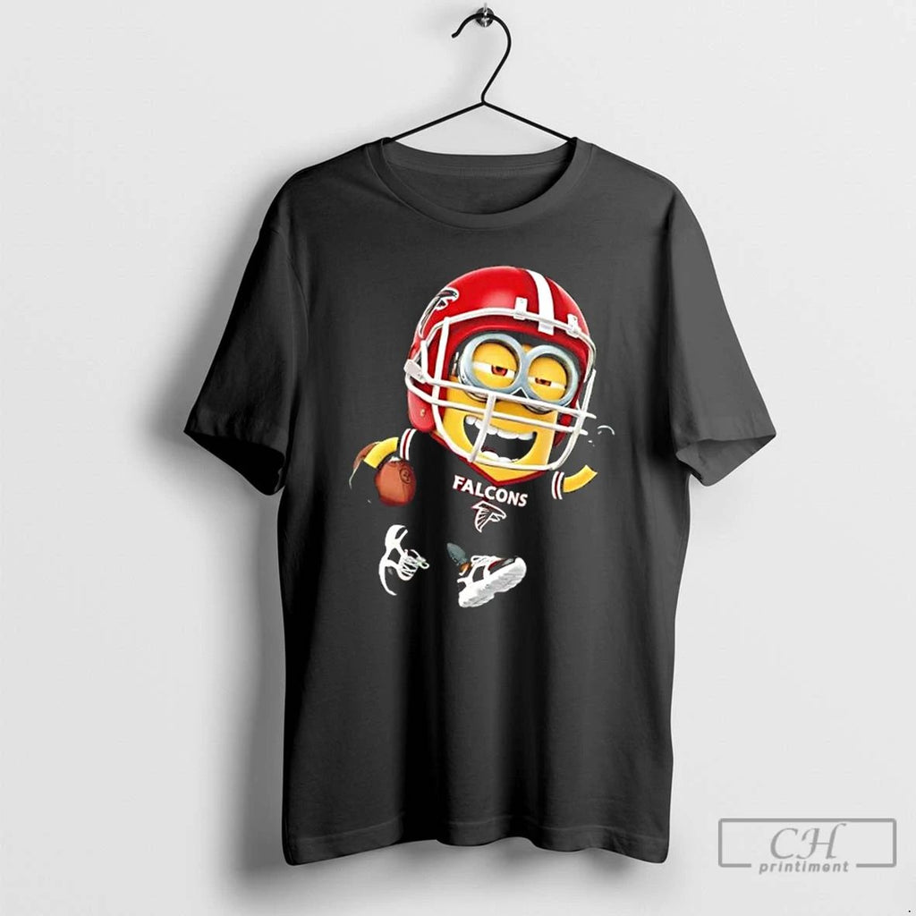 Premium Minions Is Holding A Ball And Smiling At Atlanta Falcons Fans T Shirts