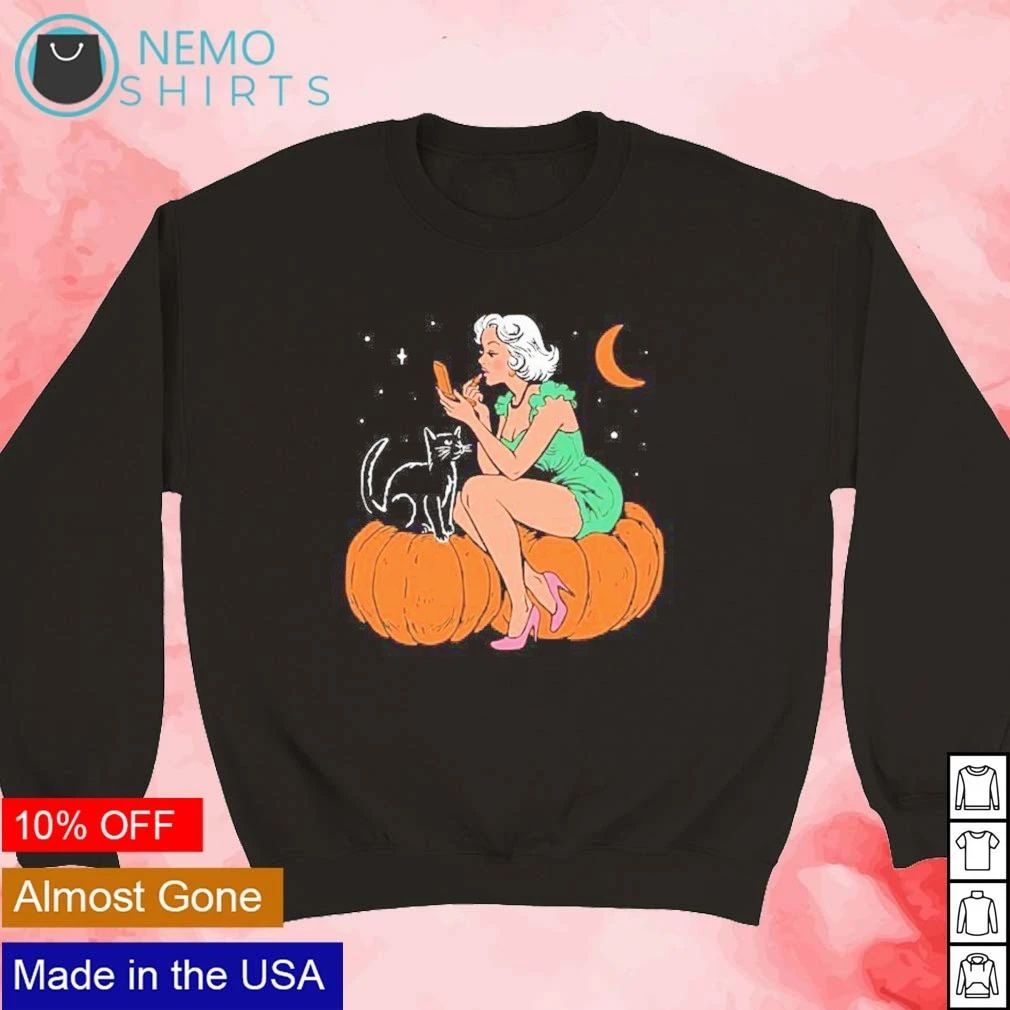 Pinup Girl Applying Lipstick on a Pumpkin with a Black Cat Halloween shirt